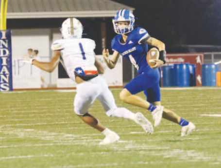 Photo by Chuck Grafe Ty Noska (4) on a fourth quarter carry.