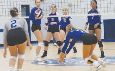 Photo by Chuck Grafe Rylan Dworsky comes up with one of the 10 digs she had in the Louise match.