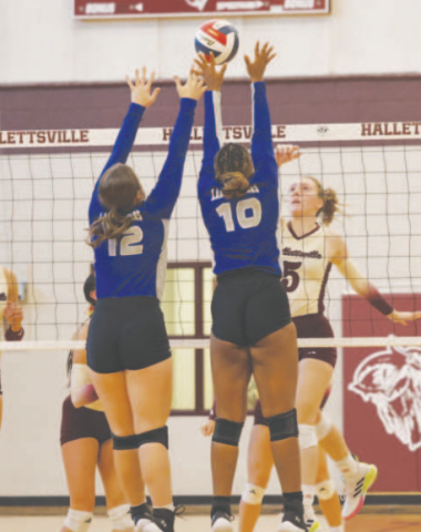 Photo by Chuck Grafe Kylee Vornsand (5) tips the ball over two Rice defenders.