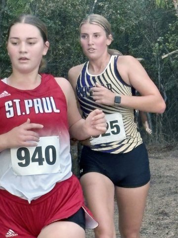 City of Shiner cross-country runners, from left Faith Brown (St. Paul) and Addy Siegel (Shiner ISD) run in the Gonzales meet on Saturday. Photo courtesy of Michelle Winkenwerder