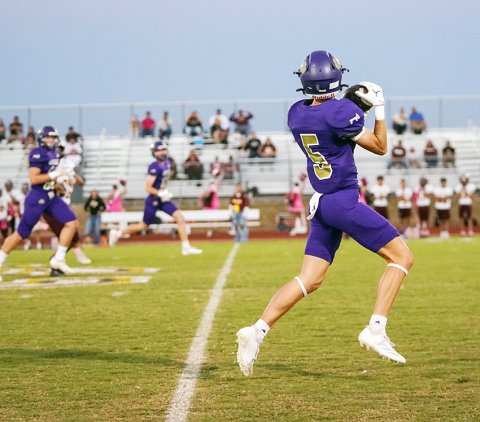 Senior receiver Boe Boehm secures the catch from Jarvis Williams. Boehm had a 66-yard touchdown reception, the longest offensive play for Shiner in the 54-0 win over Charlotte on Friday. Photo courtesy of Photos by Lori Raabe.