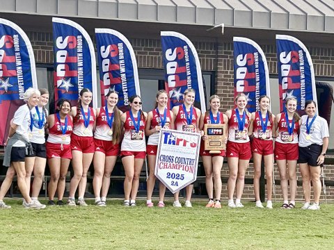 The St. Paul girls cross country team captured the TAPPS 2A state title Monday in Waco. From left are assistant coach Lindsey Morkovsky, Kylie Khelso, Ellie Rodriguez, Reese Chilek, Faith Brown, Clara Kinney, Sally Machacek, Riley Mozisek, Kristin Cerny, Skylar Mozisek, Emma Marshall, Frances FIlip and head coach Nicco Brown. Photo courtesy of Nicco Brown.