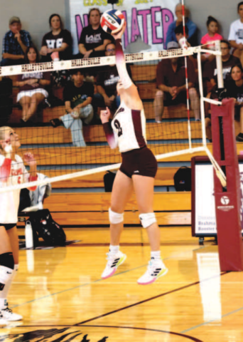 Photo by Chuck Grafe Lady Brahma setter Alaina Halata attempts a tip kill.