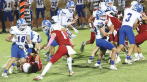 Photo by Chuck Grafe Clayton Haas (18) negotiates by Tyler Pendley.