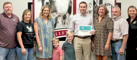 Hallettsville High School principal Mason Briscoe was recognized Monday evening at the Hallettsville Independent School District Board of Trustees meeting. With October designated as National Principal Month, Briscoe was presented a certificate for being named Region III High School Principal of the Year. In June 2026, Briscoe will be officially recognized at the TASSP Summer Workshop in Dallas. From left are Brian Smith (board president), Sandra Fellers 