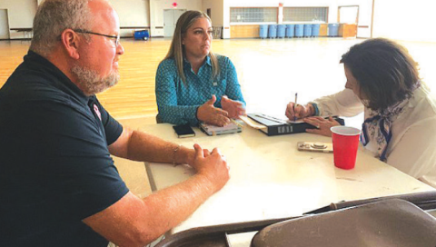 Moulton Police Chief Daniel Beyer, Lavaca County's new Mental Health Deputy Brittney Keil (center), and Senator Lois Kolkhorst.