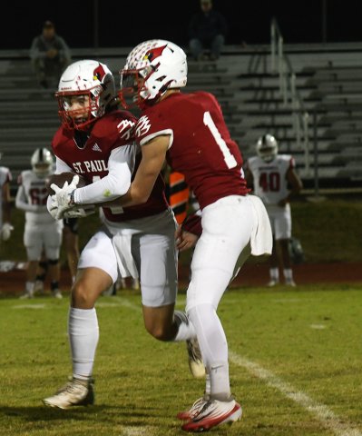 Tyler Pendley hands off to Donnie Jones in the TRC game. The two combined for 89 rushing yards and two touchdowns. Photo by Mark Lube.