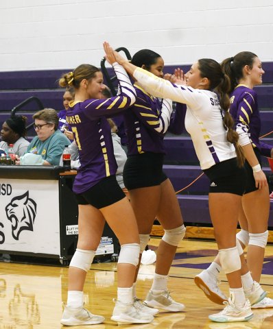 Taylor Kocian (left) and Kylynn Ramirez exchange high fives before the area-round match against Granger Nov. 3. Photo by Mark Lube.  