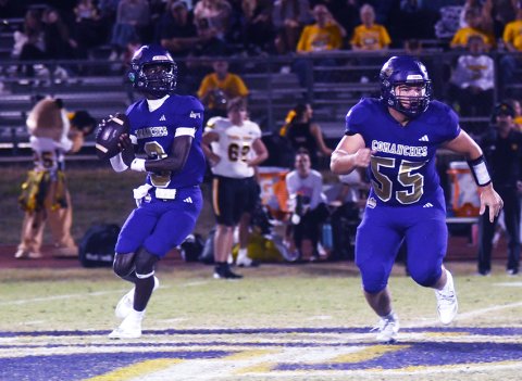 Cason Dement (right) does a great job of pass blocking for quarterback Jarvis Williams (left) on a dropback-pass play. Williams was 4-of-5 passing for 59 yards, one touchdown and one interception. Shiner rushed for over 400 yards on just 21 carries. Photo by Mark Lube.