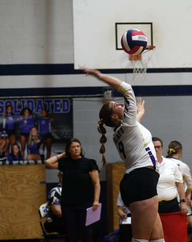 Lexi Boner makes a serve against Burton Nov. 11 at Rice Consolidated High School. Photo by Mark Lube.