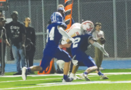 Photo by Chuck Grafe Ty Noska (2) puts a hat on Dylan Jones.