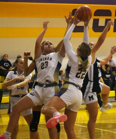 Addy Siegel secures a rebound in the Nov. 18 home game to Moulton with Kenzie Springfield helping out. The Lady Comanches hosted Hallettsvillle last week and were schedule to play cross-town rivals St. Paul this week on Tuesday Photo by Mark Lube.