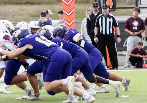 Landen Christensen and the rest of the Shiner offensive line push back Iola during first-half action in Giddings. Shiner won the game 34-14 Photo by Mark Lube.