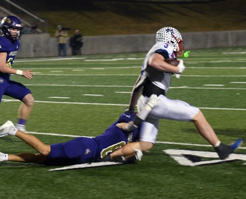 Kaegan Ash (right) believes he can escape the grasp of Tyler Harvey but the Shiner defensive back has a different take on the situation as he brings Ash down. Photo by Mark Lube.