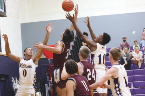 Photo by Chuck Grafe Gavyn Chapa (3) grabs a rebound in the second quarter