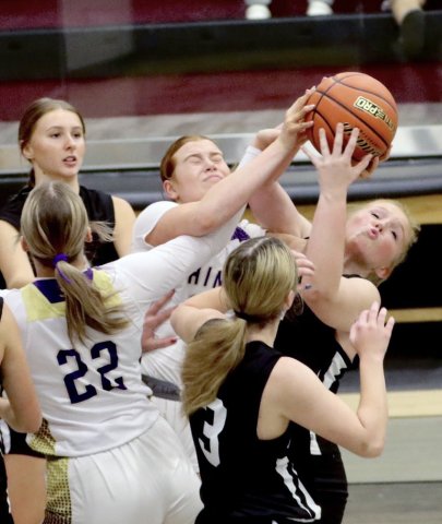 Lexi Boner tries to grab the ball during a Fayetteville Tournament game. Photo courtesy of Louann Heinsohn.