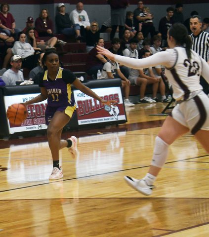 Jaliyah Barnett eyeballs a Flatonia player as she brings the ball up court in the second half. Barnett contributed four points in the Lady Comanches’ 67-35 loss. Photo by Mark Lube.