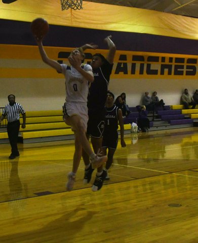 Reese Carson goes for a layup against Ganado. He chipped in four points. Photo by Mark Lube.