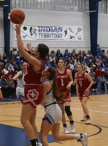 Reese Chilek goes for a second-half basket She led St. Paul with 13 points. Photo by Mark Lube.