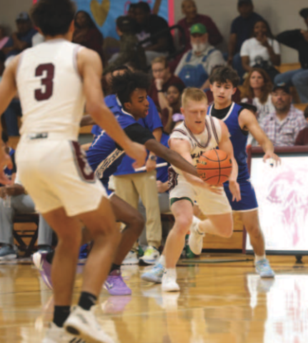 Photo by Chuck Grafe Mycole Pegoda battles for possession of a loose ball in the loss to Edna.
