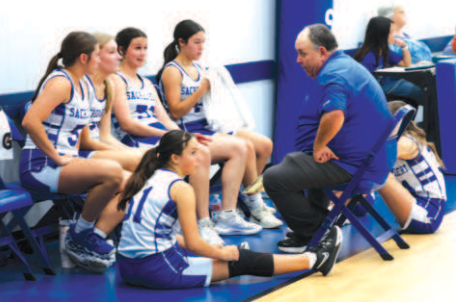 Photo by Chuck Grafe Coach Rodney Dowell talks to his troops during a time out.