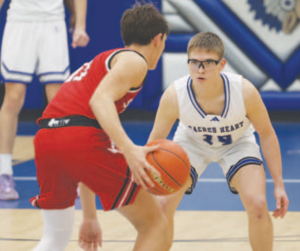 Photo by Chuck Grafe Ryan Janak guards St. Paul’s Jack Ehrig.