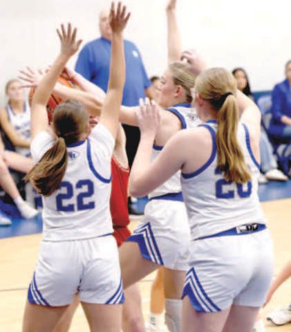 Photo by Chuck Grafe From left, Paelyn and Catherine Lemonds have St. Paul’s Skylar Mozisek in a pickle