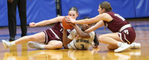 Photo by Chuck Grafe Alaina Halata, left, and Elizabeth Felcman fight for possession of the basketball with Rice’s Alberta Adams (3).