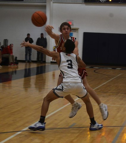 Clay Watkins gets out of some trouble by flinging a pass. Photo by Mark Lube.