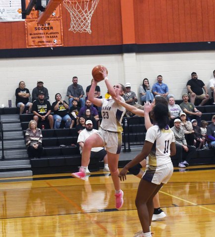 Freshman Kenzie Springfield attempts a first-half jumper against Granger while senior Jaliyah Barnett is also in on the play Feb. 16. Photo by Mark Lube.