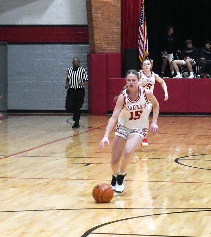 McKinley Jacobs advances the ball downcourt against Brazosport Christian on Feb. 17. She scored 11 points in the area-round game. Photo by Mark Lube.