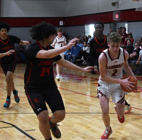 Tyler Pendley runs into the paint against Galveston O’Connell. Photo by Mark Lube.