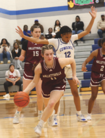 Photo by Chuck Grafe Haven Drozd dribbles out of trouble after snagging a rebound.