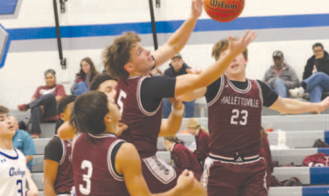 Photo by Chuck Grafe Matthew Montgomery (5) grabs a loose ball.