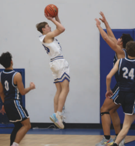 Photos by Chuck Grafe Dillon Goedrich, left, and Trent Sevcik shoot during the loss to Bulverde Bracken Christian School here Friday.