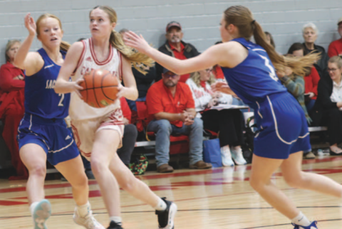 Photo by Chuck Grafe Kenzie Chance, left, and Alli Clark defend against St. Paul’s Mckinley Jacob.