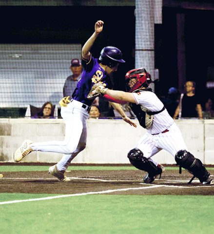 St. Paul catcher Evan Rother tags out Shiner base runner Jake Simper. Photo by Chuck Grafe/Hallettsville Tribune-Herald