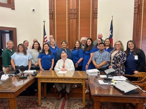 DeWitt County commissioners present a proclamation declaring April as National Child Abuse Prevention Month. Pictured are Commissioners with representatives from the DeWitt County Child Welfare Board, SJRC Belong, Norma's House, and CASA. 