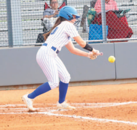 Photo by Chuck Grafe Ella Demel puts down a bunt during the Bellville win.