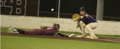 Photo by Chuck Grafe Gavyn Chapa dives back to first on a pick-off attempt vs. Stockdale.
