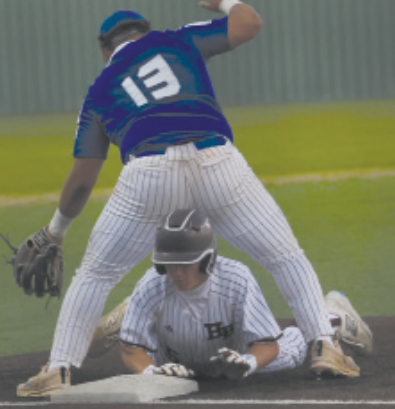 Photo by Chuck Grafe Wyatt Kram slides safely into third in the Edna game.