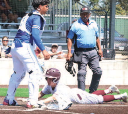Photo by Chuck Grafe Jake Ressler scores after a base hit by Weston Loudon Friday.