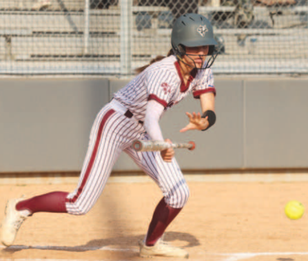 Photo by Chuck Grafe Ashlyn Pustka executes a sacrifice bunt.
