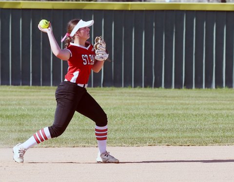 Second baseman Annie Werner makes a throw to first base against Sacred Heart on March 30.  She had four putouts and two assists in the field, and also pitched 2/3 innings. Photo by Mark Lube.