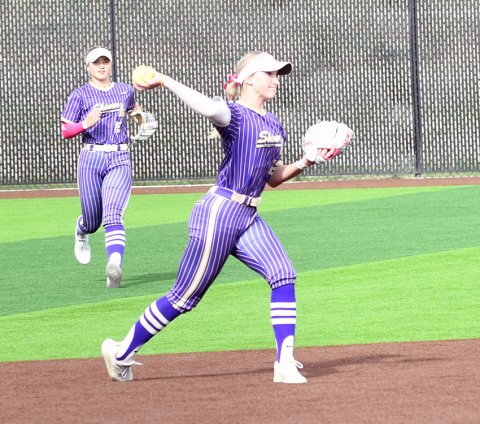 Shortstop Addy Siegel makes a throw to first base during game one with fellow senior Kara Kupka coming up to back her up.Siegel had a putout and four assists. Photo by Mark Lube.