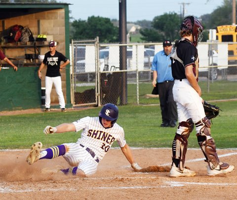 Charlie Clifford slides into home during his inside-the-park blast. He had two hits and also pitched 2 1/3 innings. Photo by Mark Lube.