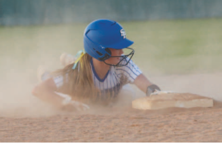 Kenzie Chance slides in safely, during Thursday’s game.