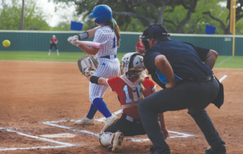 Photo by Chuck Grafe Ella Demel hits a three-run homer in the first inning in the Tuesday, April 14 game with St. Paul