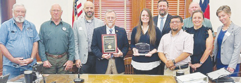 The Texas Association of Counties Risk Management Pool (TAC RMP) presented a Safety Achievement Award to DeWitt County. DeWitt County commissioners accepted the award. Human Resource Director Ashley Hunt (pictured fifth from left) also was a recipient of the 2025 Making a Difference Award from TAC RMP. Pictured with Hunt are members of TAC RMP and DeWitt County commissioners.