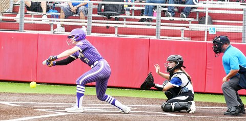 Cami Cowan  lays down a bunt in the second inning in the second game against Mumford. Her play allowed Reagan Fluitt to advance to third base. Photo by Mark Lube.